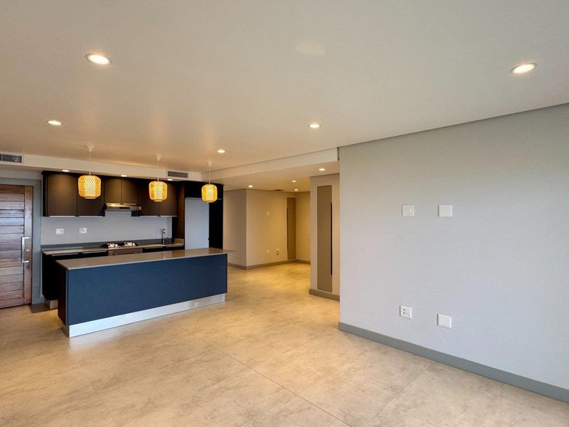 This is a premium, move-in-ready coastal apartment that combines luxury, security, and modern convenience in a sleek, never-before-lived-in space. - Photo 1