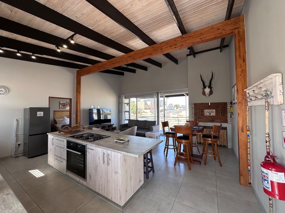 Main Flat, 2 ensuite bedrooms, open plan kitchen with lounge and inside barbecue and balcony.