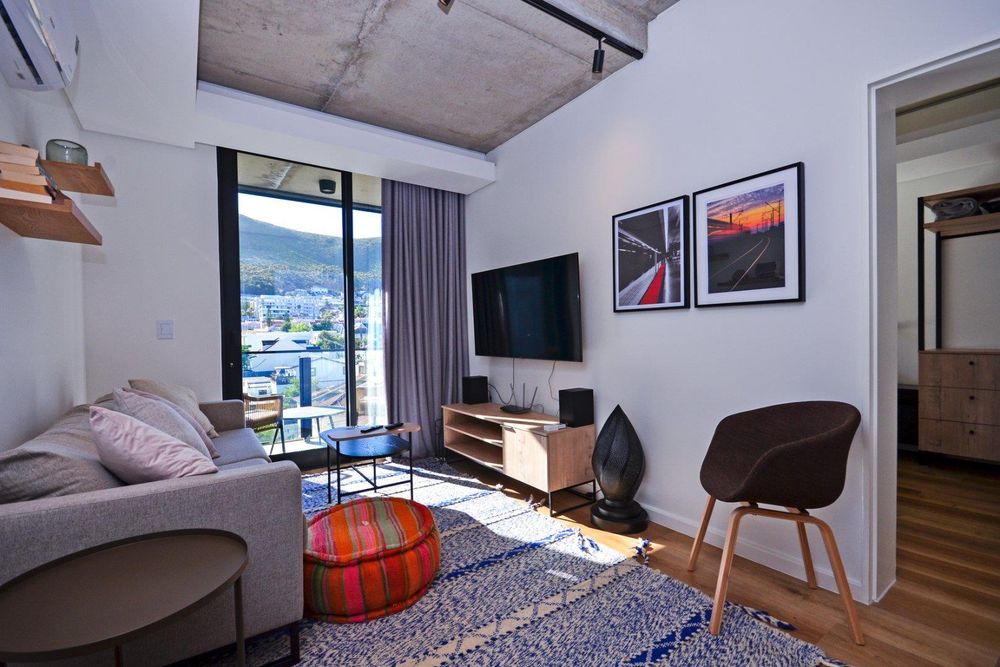 Open plan lounge leads to balcony