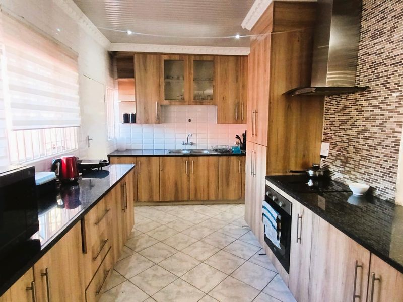 Spacious Suburban Gem:3-Bedroom Retreat with Pool and 3 Living Areas - Photo 2