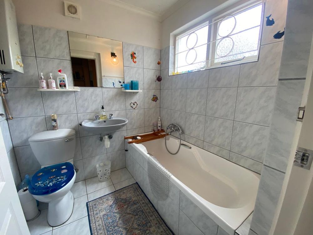 Bathroom behind the bookshelf