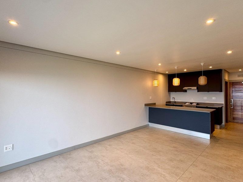 This brand-new, never-before-lived-in apartment offers a refined coastal lifestyle with breathtaking panoramic sea views and sleek, modern finishes throughout - Photo 3