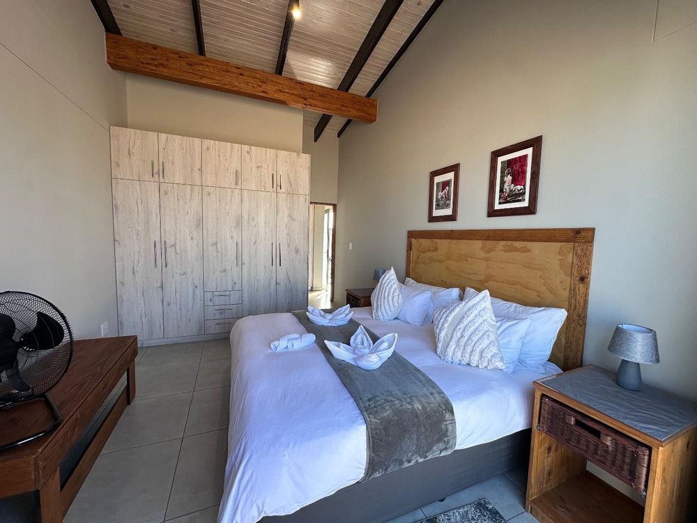 Main Flat, 2 ensuite bedrooms, open plan kitchen with lounge and inside barbecue and balcony.