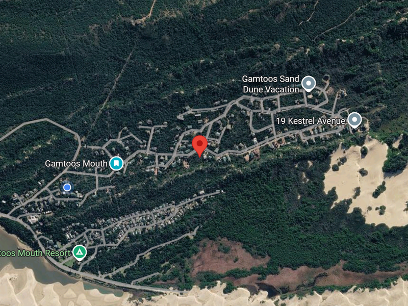 An aerial satellite view showing the residential layout and surrounding landscape of the Gamtoos Mouth area.