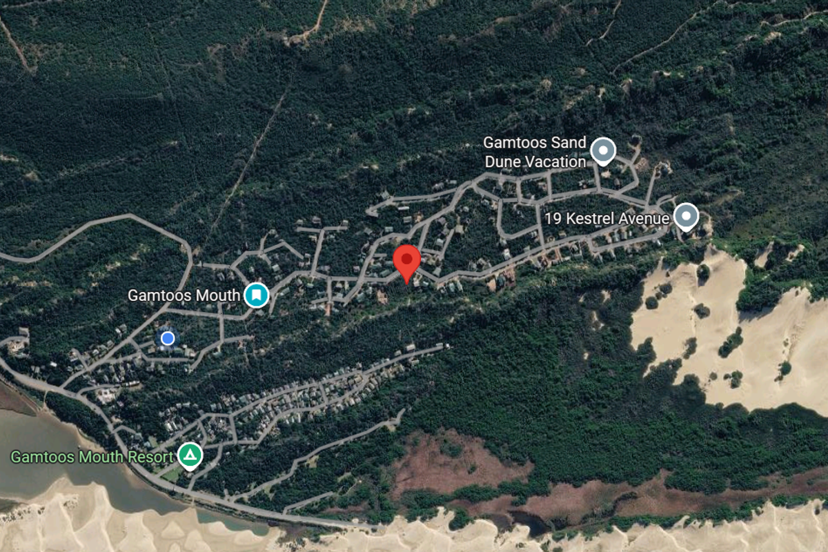 An aerial satellite view showing the residential layout and surrounding landscape of the Gamtoos Mouth area.