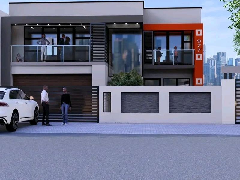 A modern double-storey residential facade featuring clean lines, integrated balconies with glass balustrades, and a secure gated entrance.