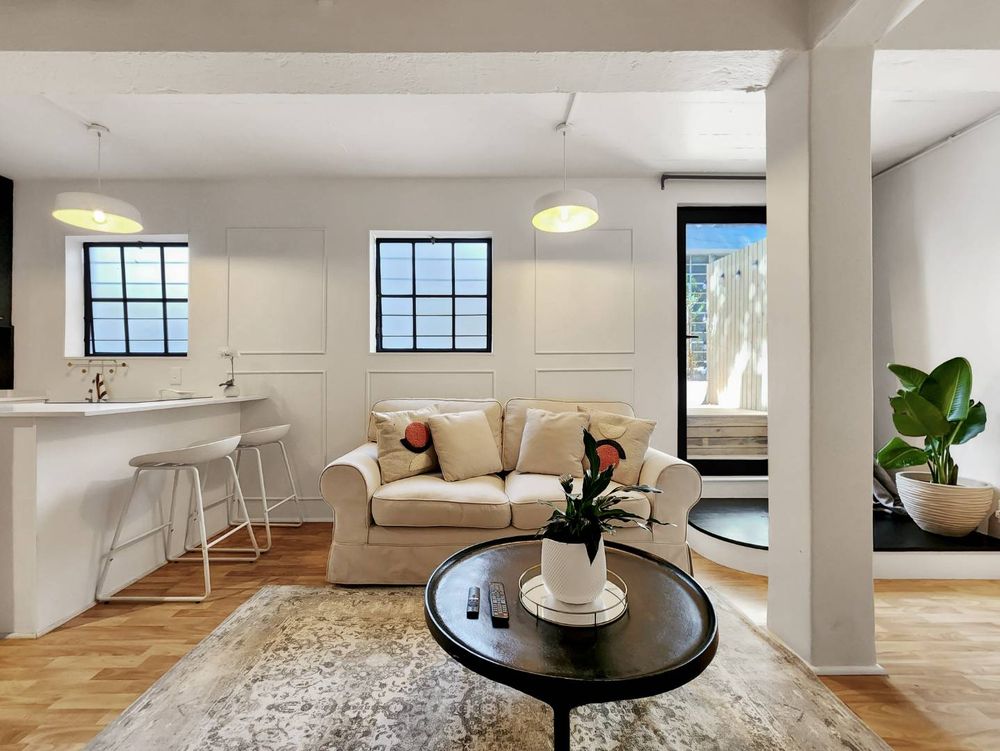 Living area with access to outdoor wooden decked area