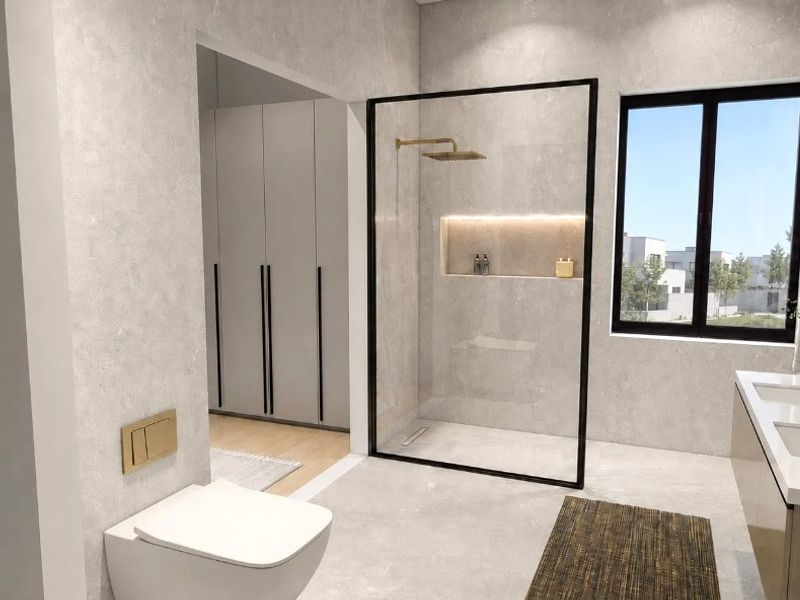 Modern bathroom featuring a walk-in shower with black frame, double vanity, wall-hung toilet, and integrated storage, finished with contemporary fixtures and neutral tiling.