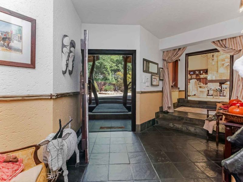 AN EXQUISITE, BUSH LODGE-THEMED, FAMILY SANCTUARY OFFERING TIMELESS ELEGANCE AND UNMATCHED TRANQUILITY IN A SERENE INDIGENOUS GARDEN SETTING - Photo 7