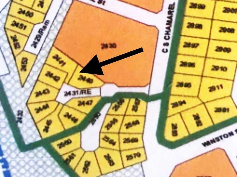 A cadastral map or site plan highlighting a specific residential land plot within the neighborhood layout.