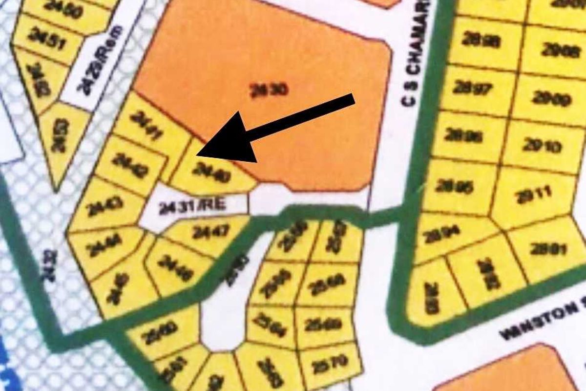 A cadastral map or site plan highlighting a specific residential land plot within the neighborhood layout.
