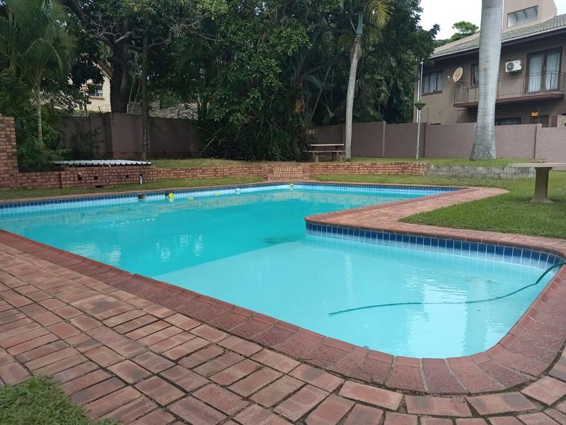 Charming 2-Bedroom Simplex with Modern Comforts & Complex Pool - Photo 7
