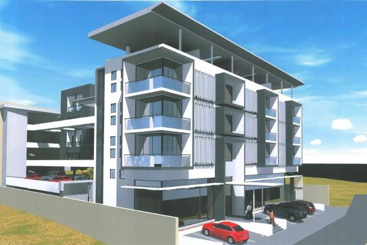A modern multi-story office building featuring contemporary architectural design, glass balconies, and integrated covered parking facilities.