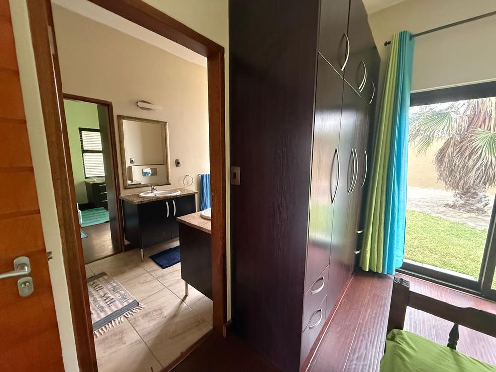 Ground floor, bedroom two, built-in cupboards and shared bathroom