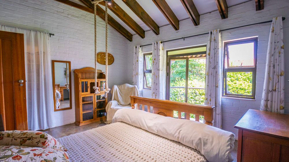 2nd large bedroom with Juliet balcony over garden and a lovely treed view