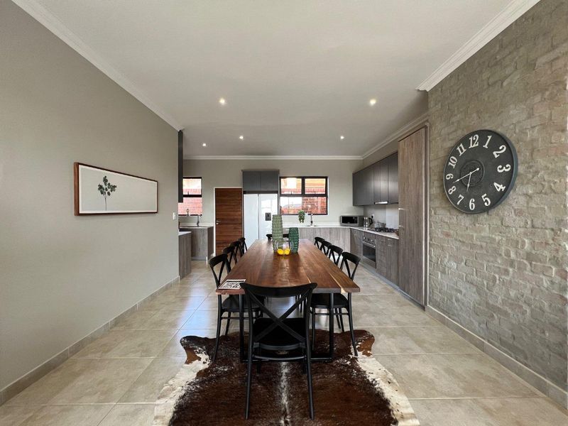 Unique iQ Marula 3-Bedroom Single-Level Townhouse with stacking doors by the patio and Double Garage - Photo 10