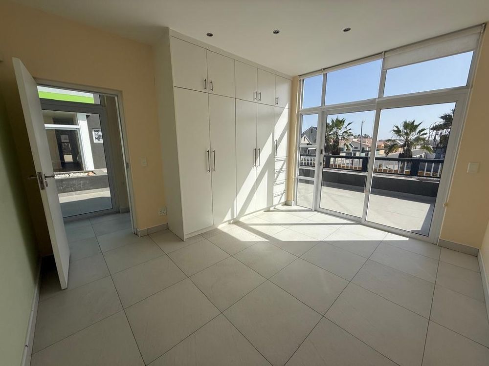 Bedroom one with BIC and balcony