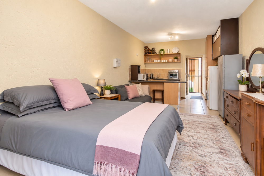 Declutterred Bed Area to lounge to kitchen