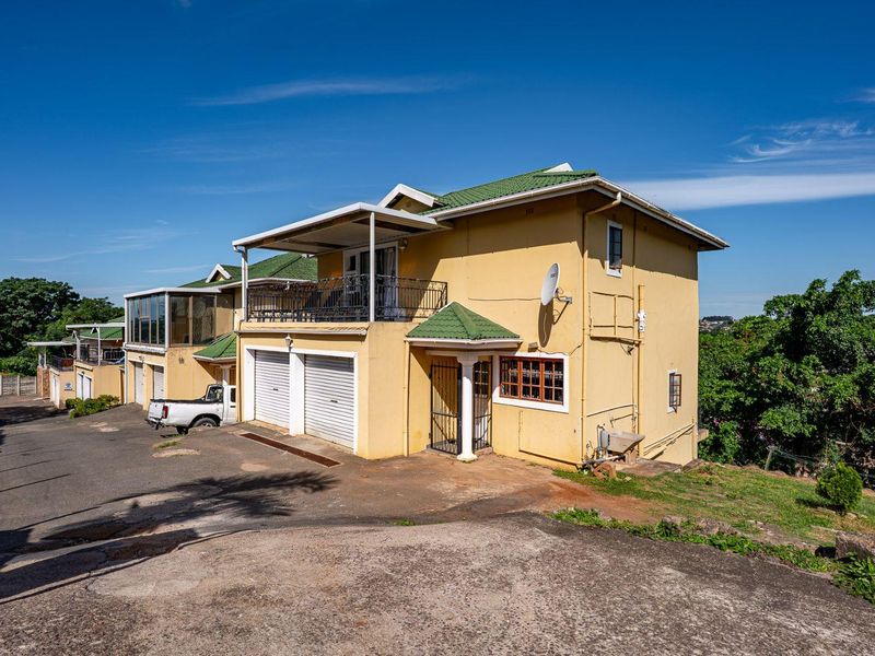 Spacious Hillside Townhouse with Scenic Views & Great Potential - Photo 2