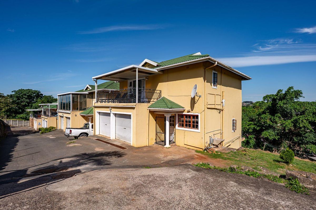 Spacious Hillside Townhouse with Scenic Views & Great Potential - Photo 2