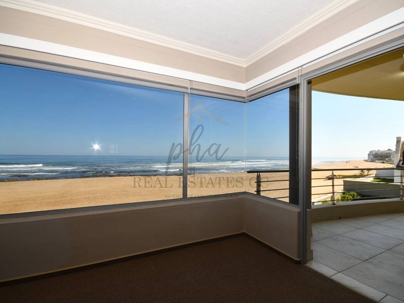 Exceptional Double-Story Beachfront Home with Unobstructed Sea Views - Photo 4