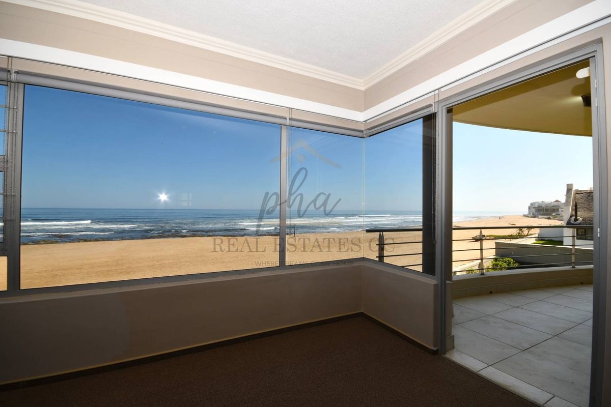 Exceptional Double-Story Beachfront Home with Unobstructed Sea Views - Photo 4