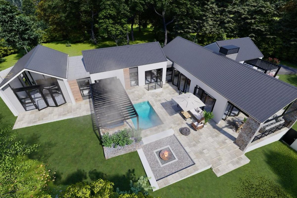 Aerial view of a modern residential property featuring a central courtyard, swimming pool, stone-paved patio, and a built-in fire pit area.