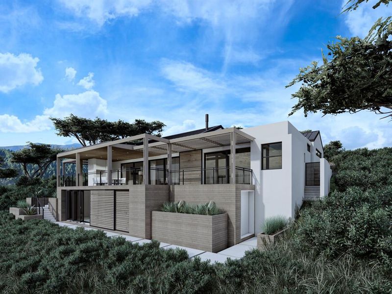 Modern architectural rear elevation featuring timber cladding, expansive covered patio, and glass balustrades set within a natural landscaped environment.