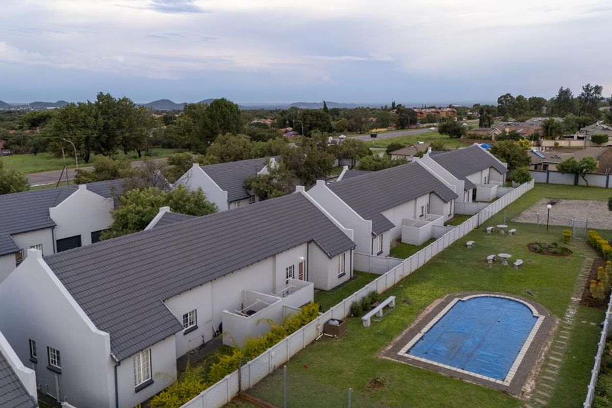 SECURE LIVING WITH POTENTIAL: 2-BEDROOM HOME WITH CHARM - Photo 2