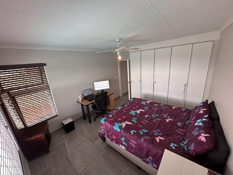 Modern 2-Bedroom Townhouse with Patio and Private Courtyard in Rangeview in Cosmos Complex - Photo 5