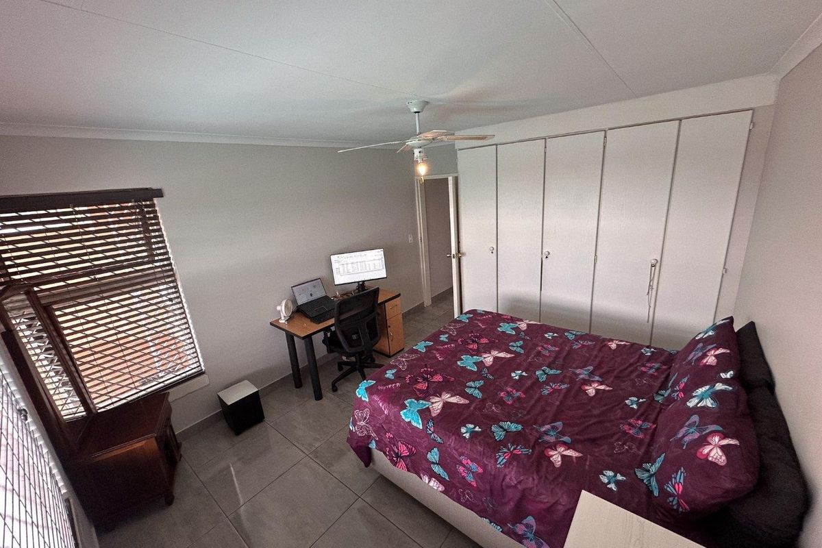 Modern 2-Bedroom Townhouse with Patio and Private Courtyard in Rangeview in Cosmos Complex - Photo 5