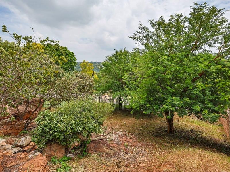 Nestled in a sought-after estate in Pretoria East, this exceptional 431 sqm parcel of land offers a rare opportunity to build your dream home in a setting of timeless beauty. With sweeping, breathtaking views, this is the closest you’ll come to the e - Photo 6