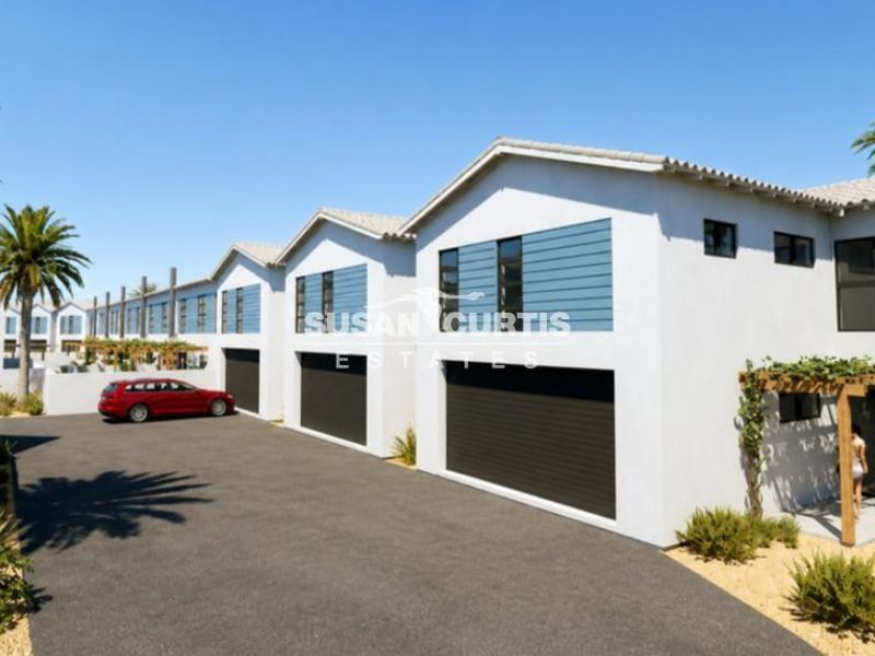 Modern townhouse exterior featuring a clean facade, tiled roofing, integrated garage doors, and a timber pergola entrance.