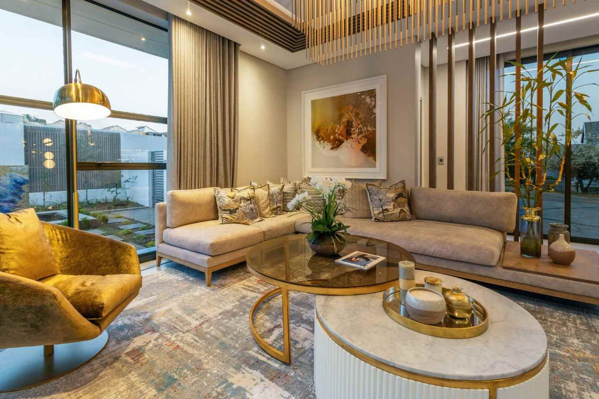 Elegant living room featuring floor-to-ceiling windows, modern slatted ceiling detailing, and a sophisticated timber room divider, creating a bright and contemporary atmosphere.