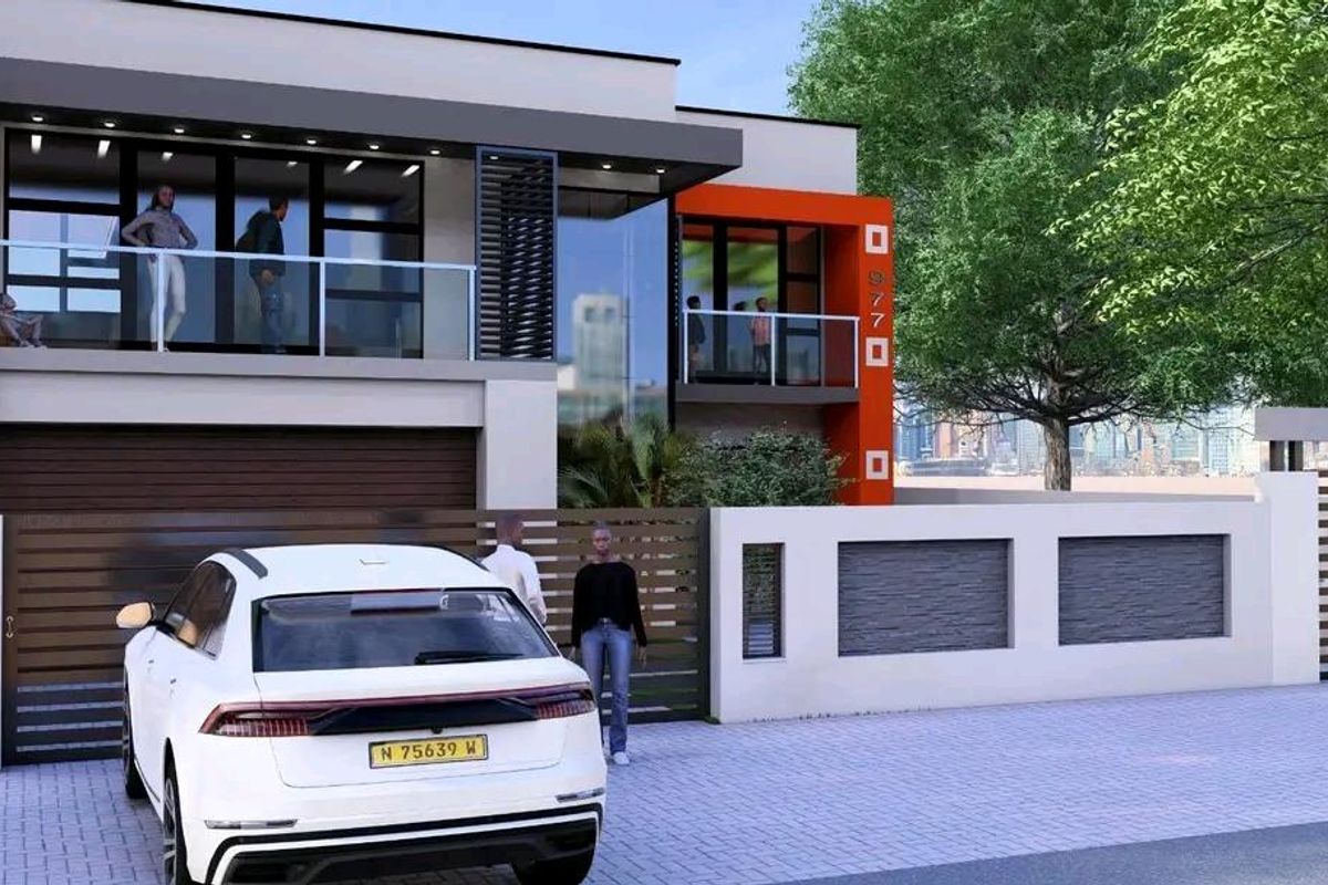 Modern two-story residential facade featuring glass balconies, clean architectural lines, and a secure gated entrance with a private driveway.