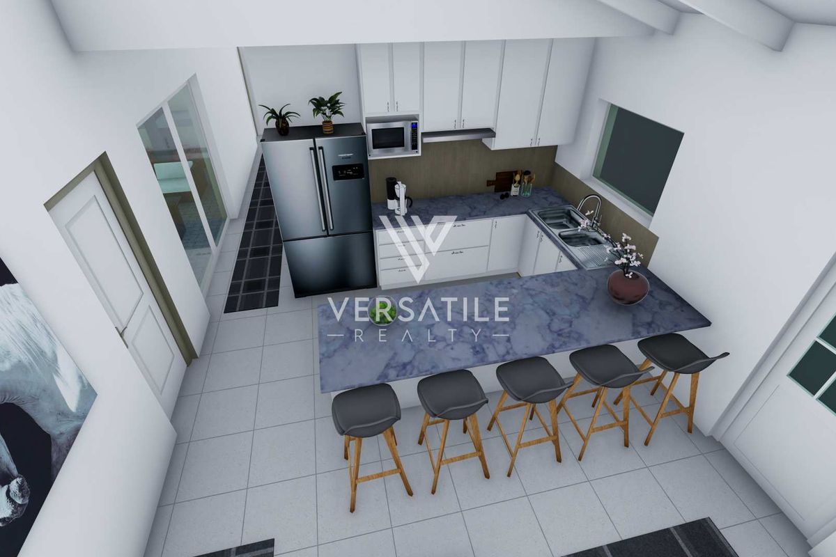 Modern open-plan kitchen featuring white cabinetry, stone-look countertops, a breakfast bar, and integrated stainless steel appliances.
