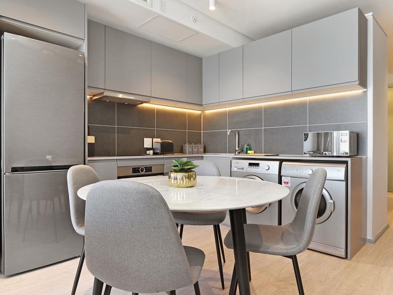 Experience City Living with a Serene Mountain Backdrop - Photo 9