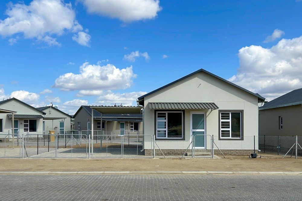 Freestanding townhouse with provision for future expansion and carport.