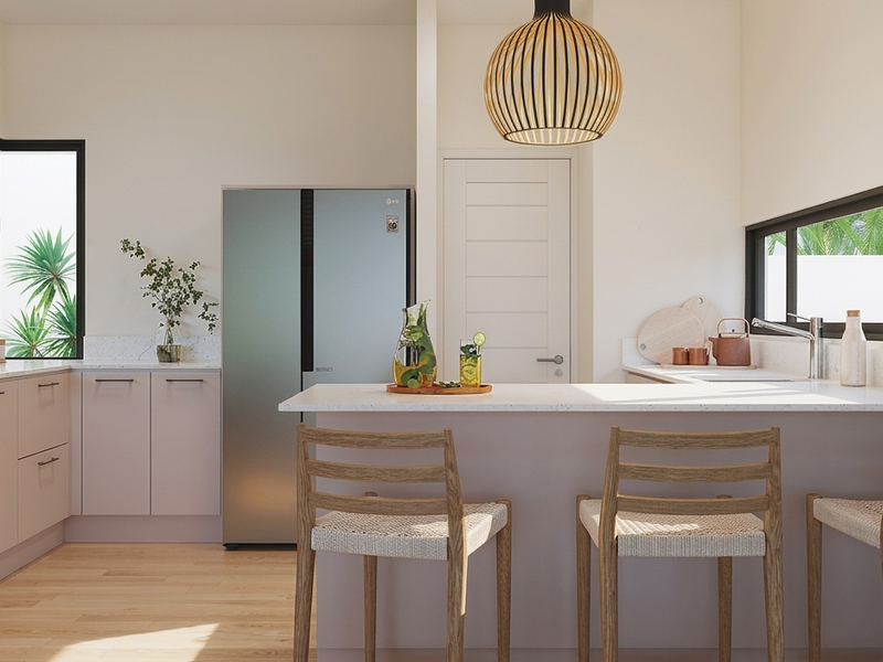 Modern kitchen featuring sleek cabinetry, stone countertops, integrated appliances, and a breakfast bar, finished with high-quality materials and natural light.