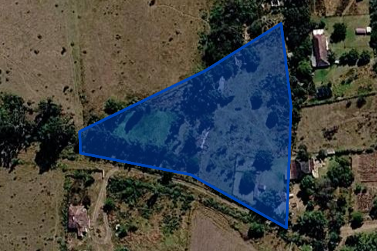 An aerial view showing the boundaries of a land parcel in a rural setting.