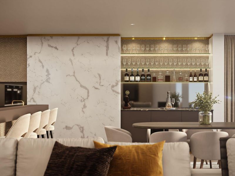 Sophisticated open-plan living area featuring a marble accent wall, custom built-in bar with integrated shelving, and high-end finishes throughout.