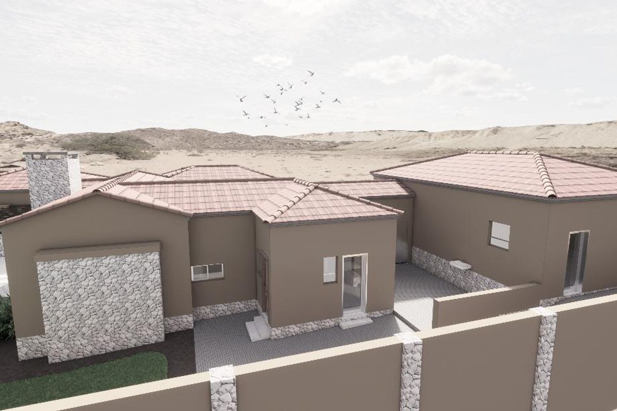 An aerial view of a modern residential property featuring tiled roofing, stone cladding accents, and a paved courtyard area.