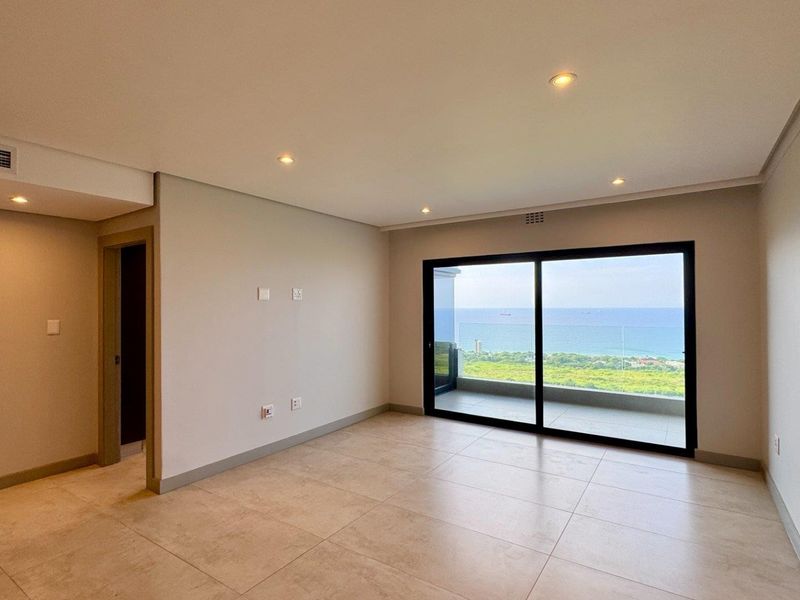 This brand-new, never-before-lived-in apartment offers a refined coastal lifestyle with breathtaking panoramic sea views and sleek, modern finishes throughout - Photo 6