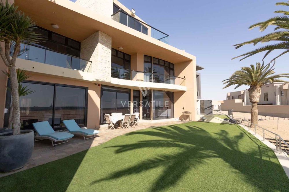 3 Beach front patio area with artificial lawn