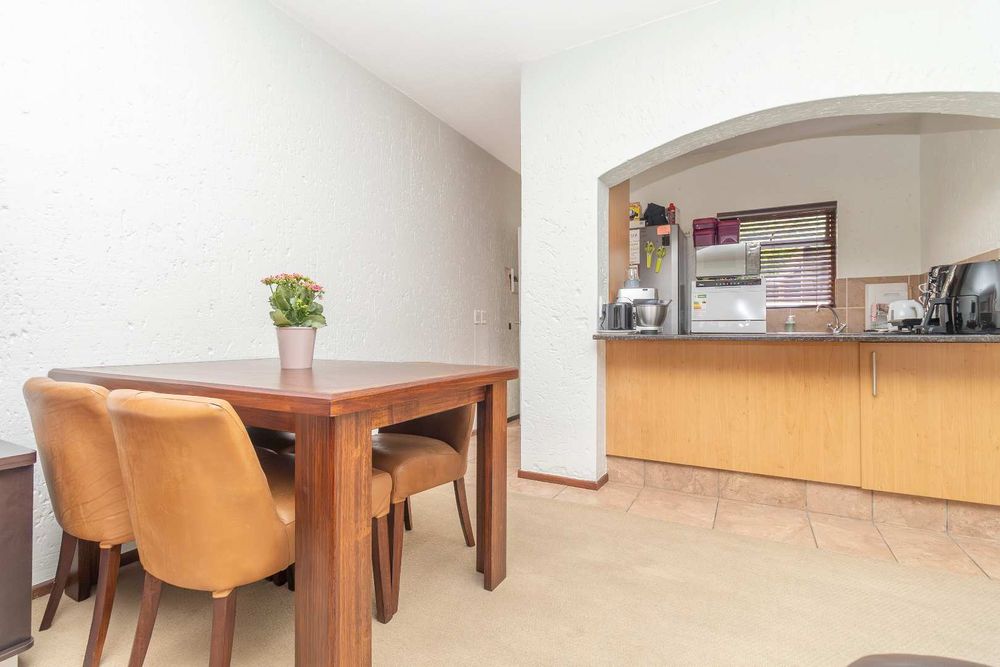 Living area dining towards kitchen