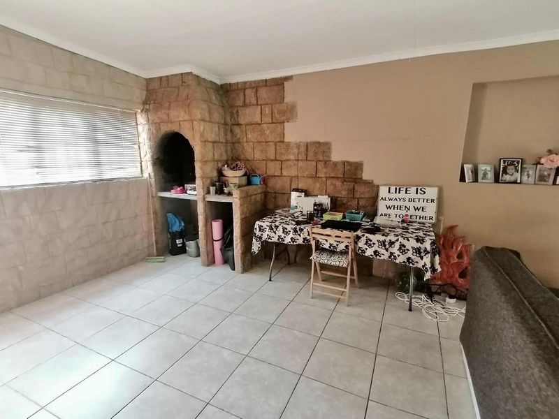 This charming 3-bedroom home offers spacious living areas, a modern kitchen, and a cozy backyard perfect for relaxation. - Photo 4