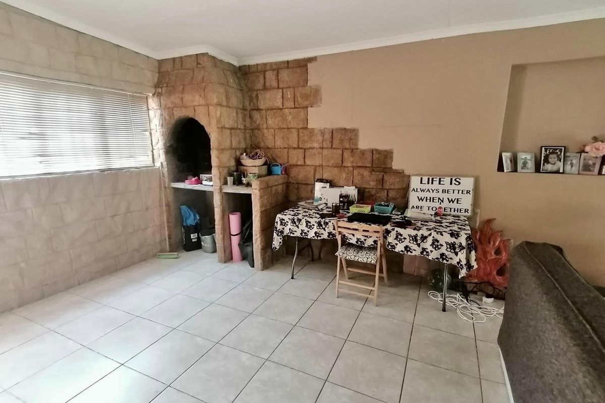 This charming 3-bedroom home offers spacious living areas, a modern kitchen, and a cozy backyard perfect for relaxation. - Photo 4