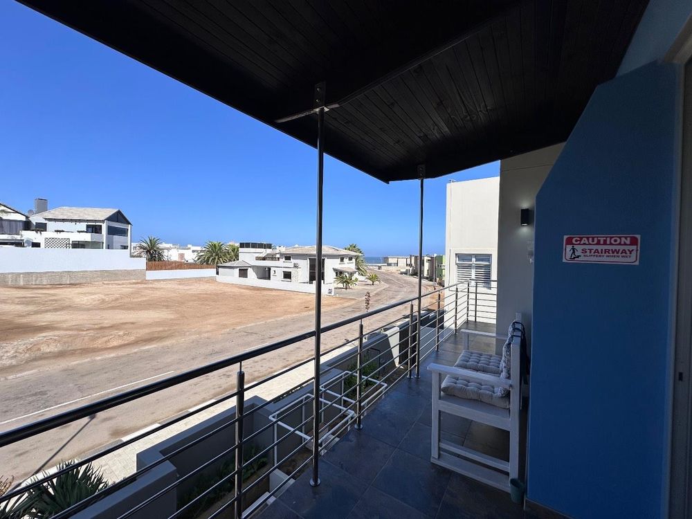 Main Flat, 2 ensuite bedrooms, open plan kitchen with lounge and inside barbecue and balcony.