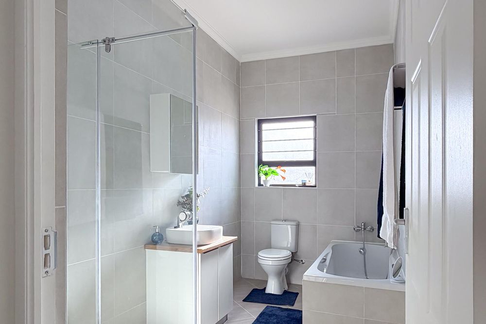 Family bathroom with both shower and bath.