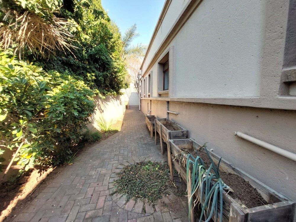 View from the exterior kitchen door to the back of the property.